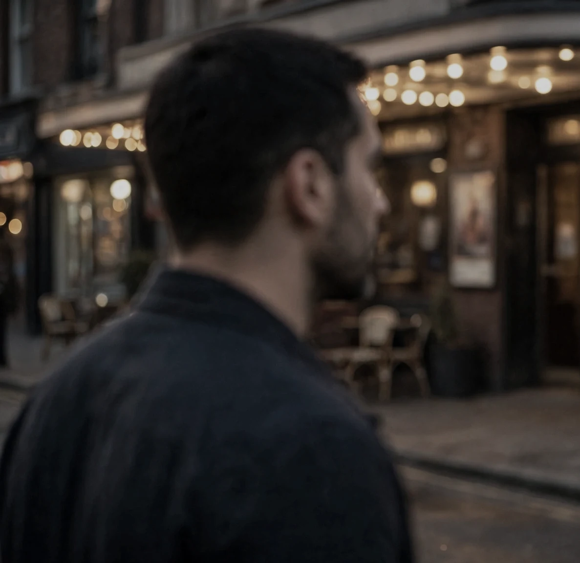 The man left standing alone, looking at the empty street